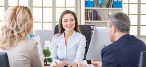 woman discusses roofing options with a couple