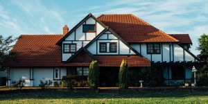 white house with brown roof