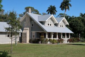 a house with a large front yard and a large front porch