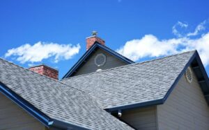 a roof with gray shingles and blue trim