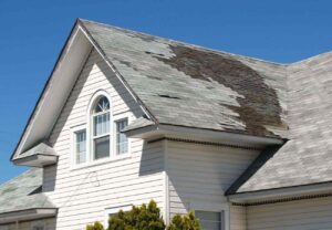 A roof that is damaged due to storm in Stockton.