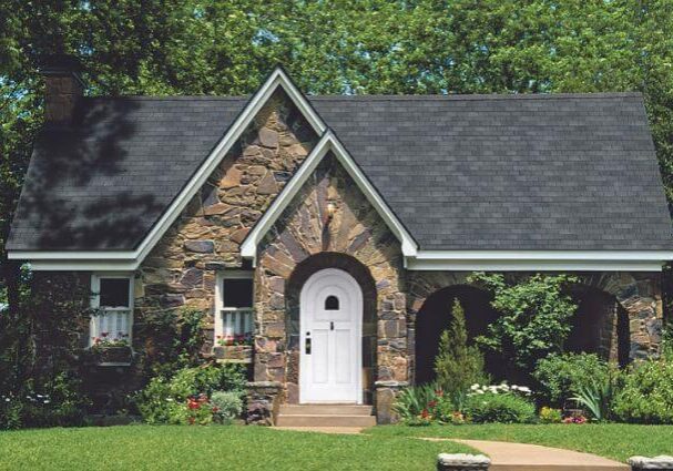 a stone house with a white door