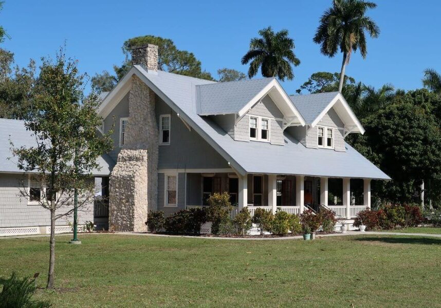 a house with a large front yard and a large front porch